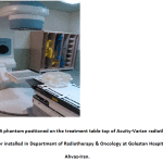 Figure 1. A phantom positioned on the treatment table top of Acuity-Varian radiotherpy simulator installed in Department of Radiotherapy and Oncology at Golestan Hospital of Ahvaz-Iran.